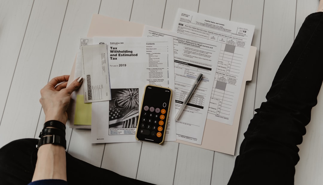 Reviewing personal loan documents and calculating monthly finances